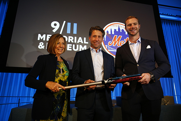 Alice Greenwalk, President and CEO of the 9/11 Memorial & Museum, Mets CEO Jeff Wilson, and Pete Alonso pose for a group picture.