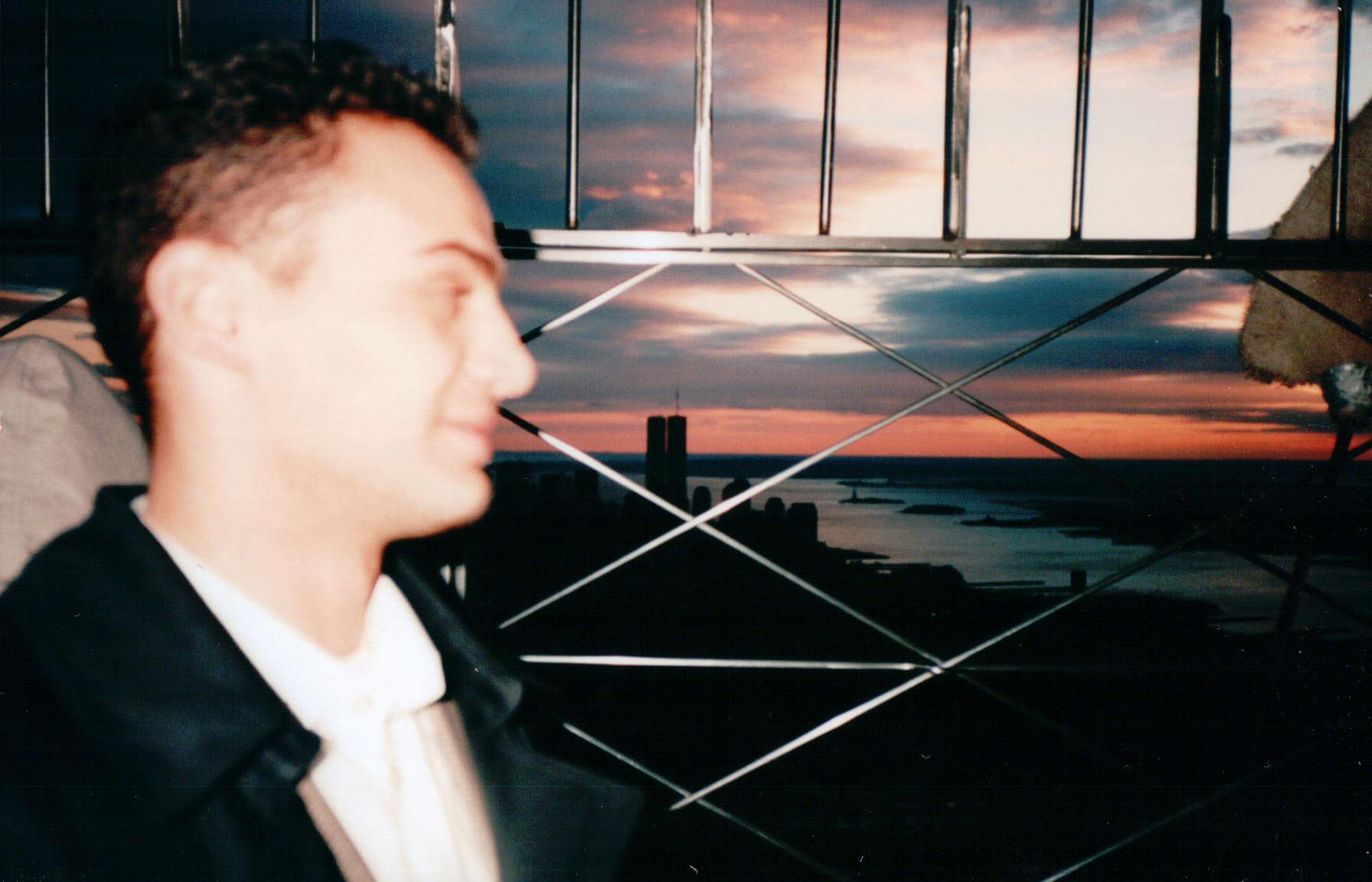 A photo taken of my father from the observation deck of the Empire State Building overlooking the city in 1996