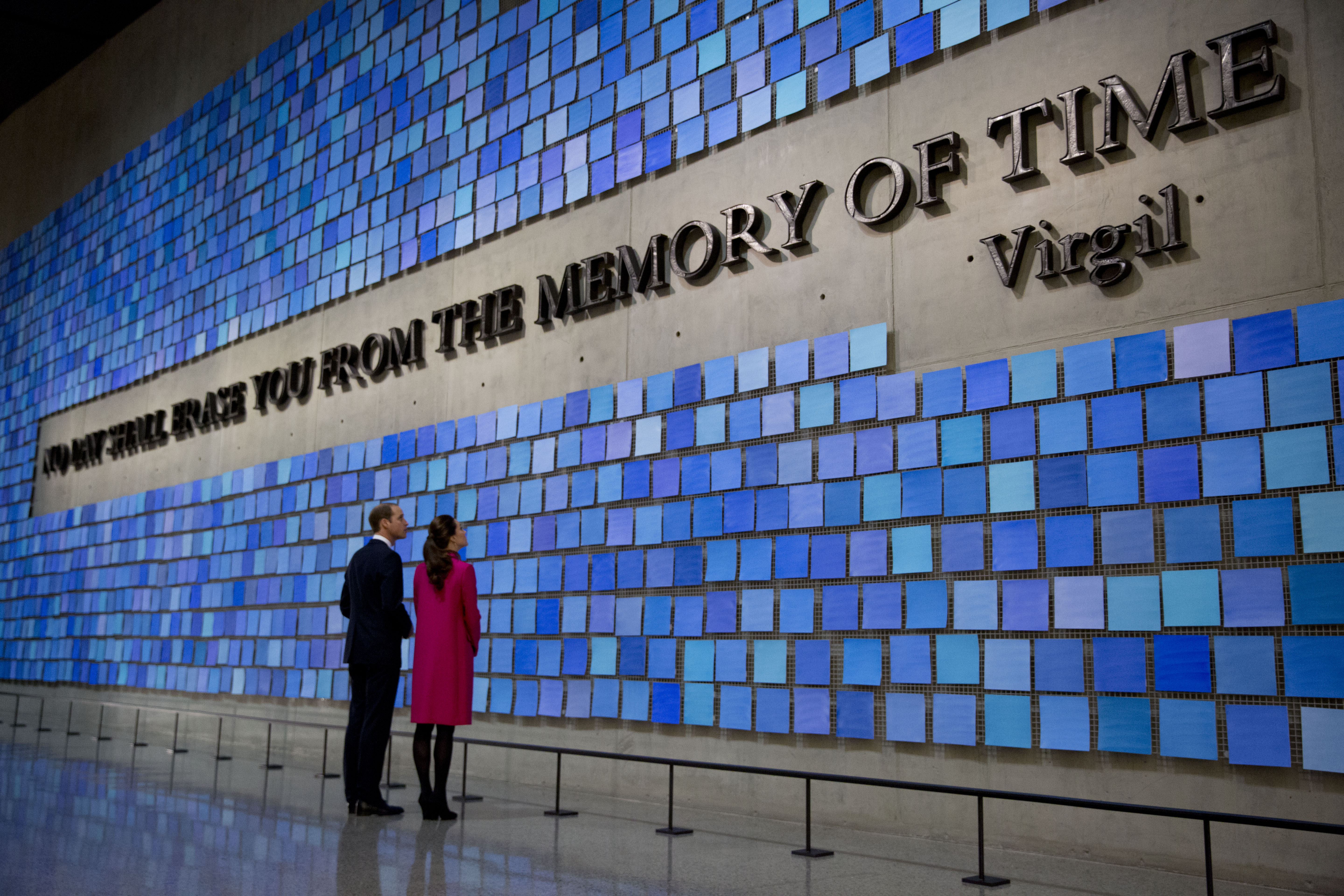 Prince William, Duke of Cambridge, and Catherine, Duchess of Cambridge, view artist Spencer Finch’s work “Trying to Remember the Color of the Sky on That September Morning” in Memorial Hall at the Museum. The artwork features the Vigil quote, “No day shall erase you from the memory of time.” The quote is surrounded by 2,983 squares of Fabriano paper hand-painted different shades of blue.