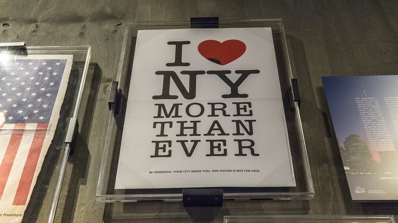 The "I Heart NY More Than Ever" poster hangs in the 9/11 Memorial Museum's historical exhibition gallery.