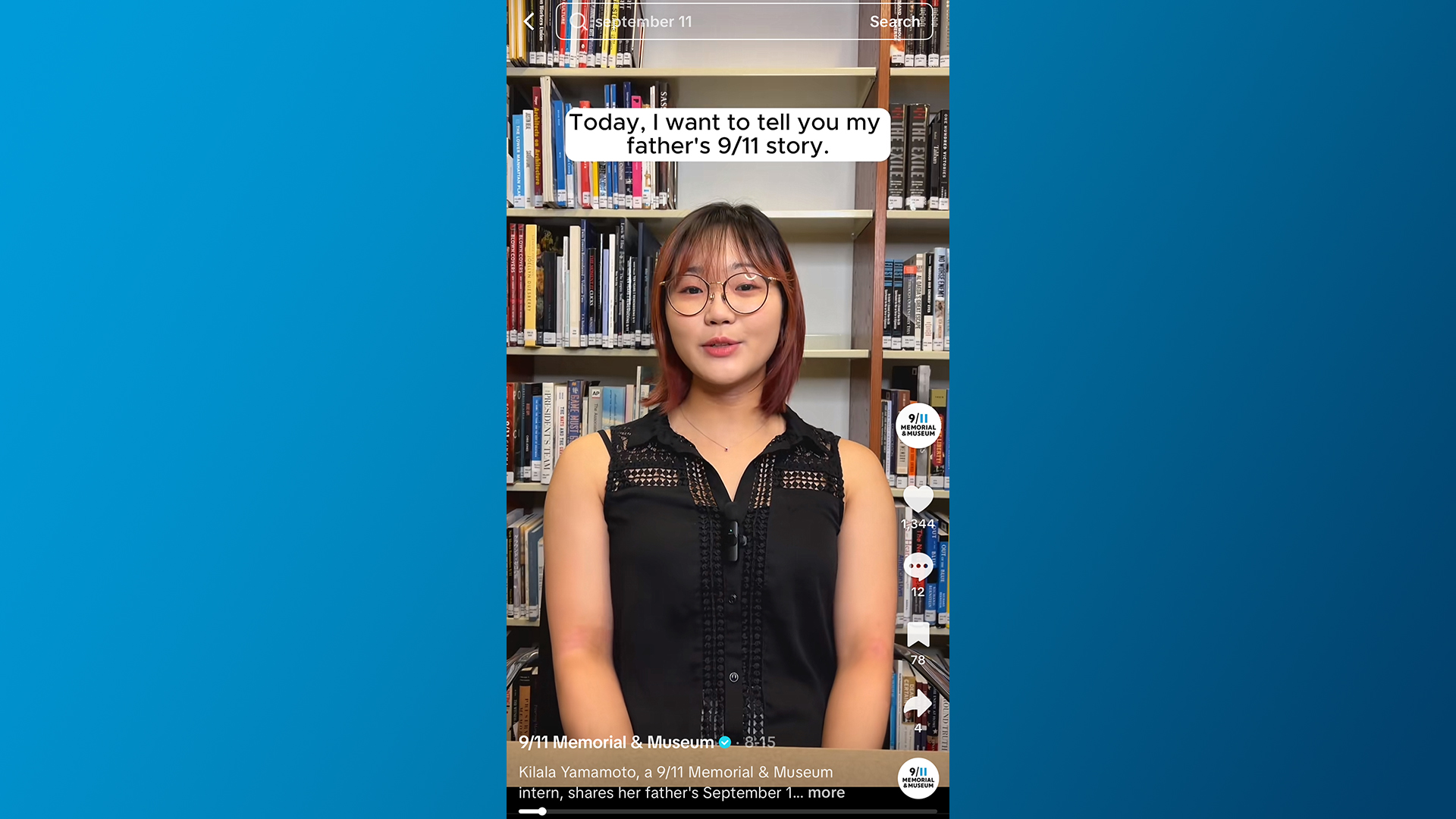 Kilala Yamamoto, wearing glasses and a black top, stands in front of bookcases.