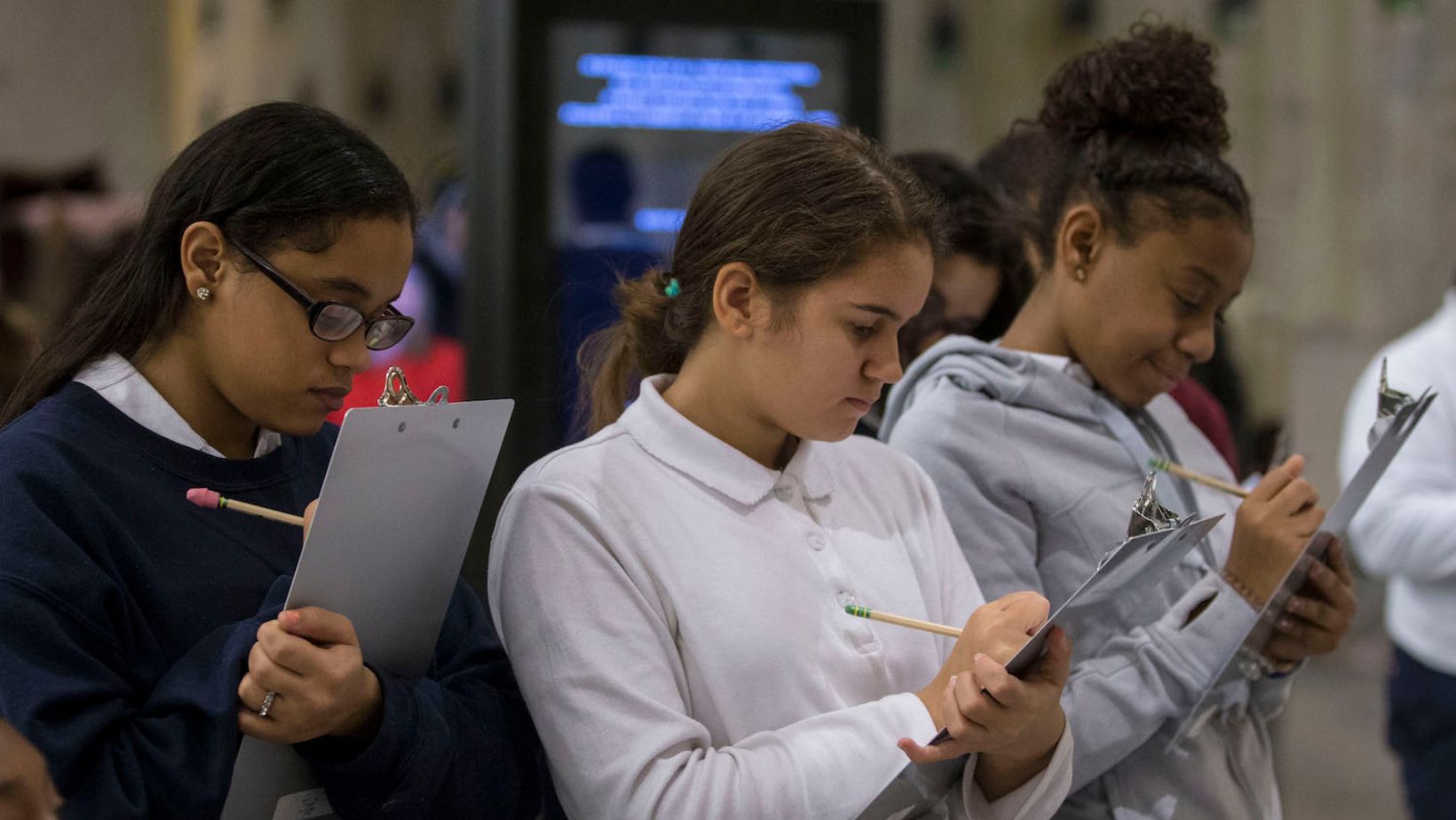 Students taking notes during a field trip