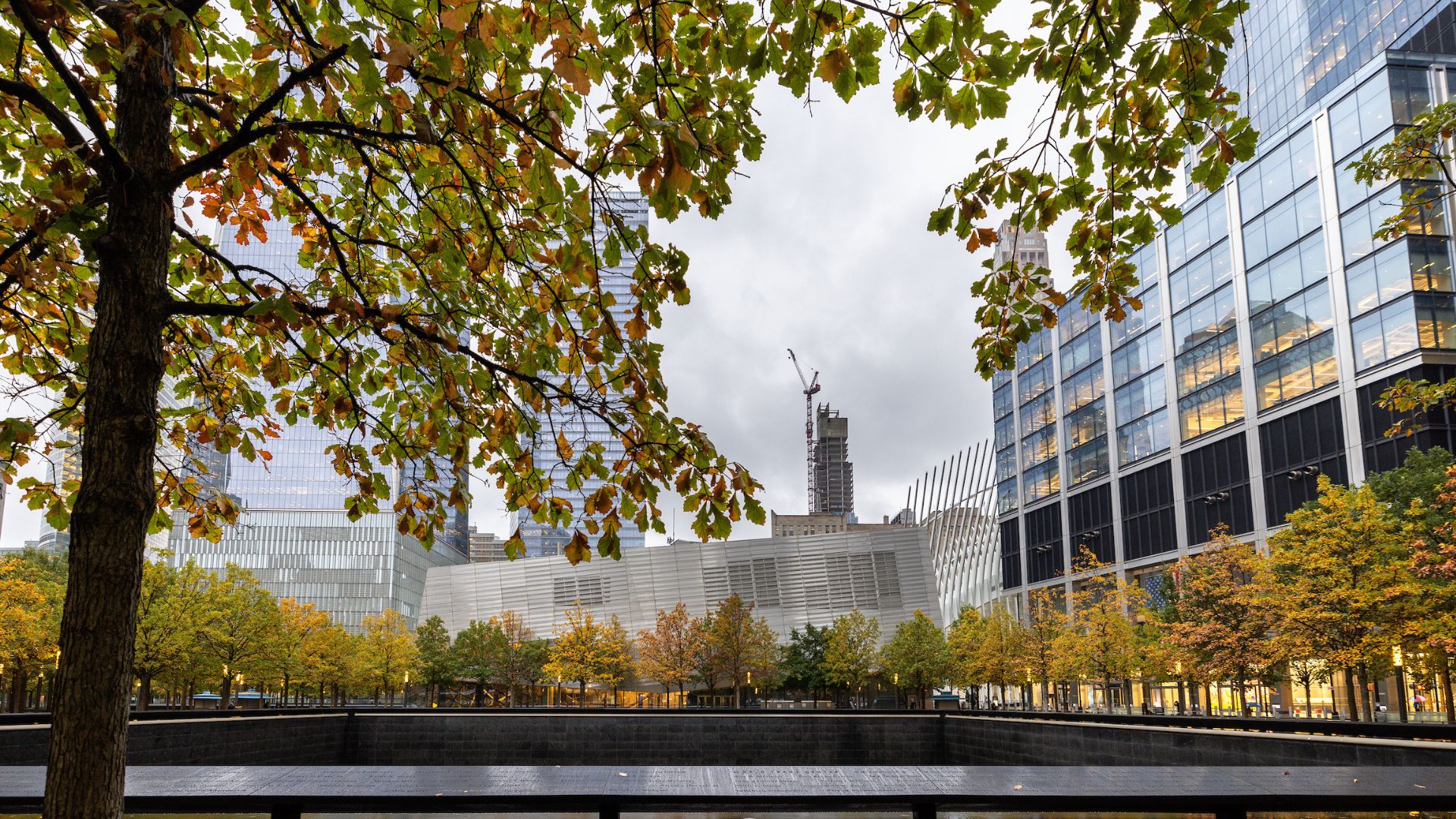 Fall foliage surrounds the Memorial, with the Museum in the background