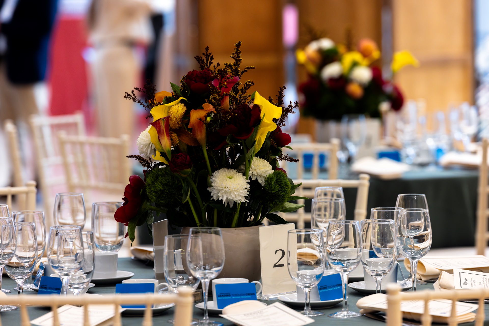 A beautiful table setting with flowers and crystal