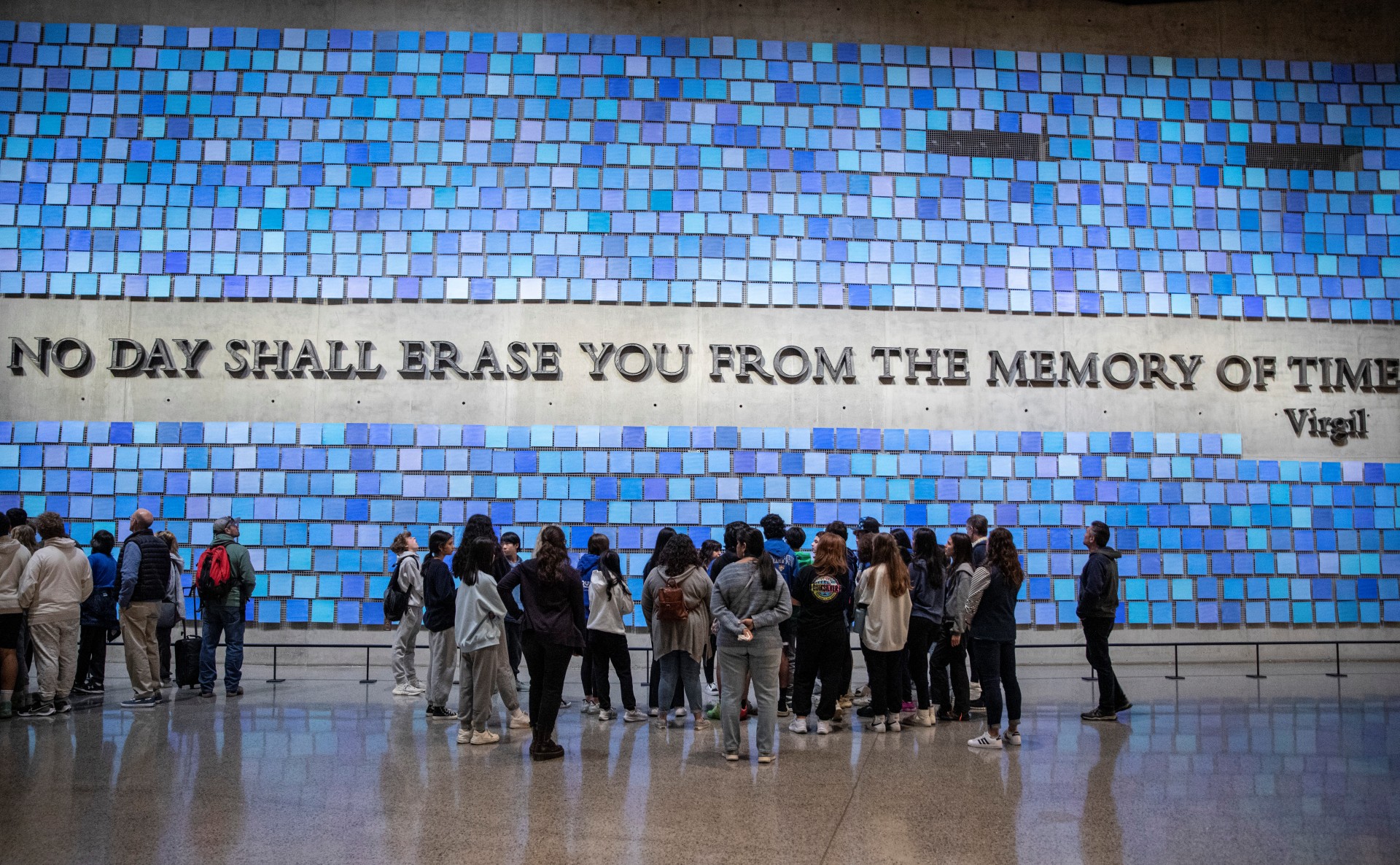 a group of students standing in front of the Spencer Finch exhibit