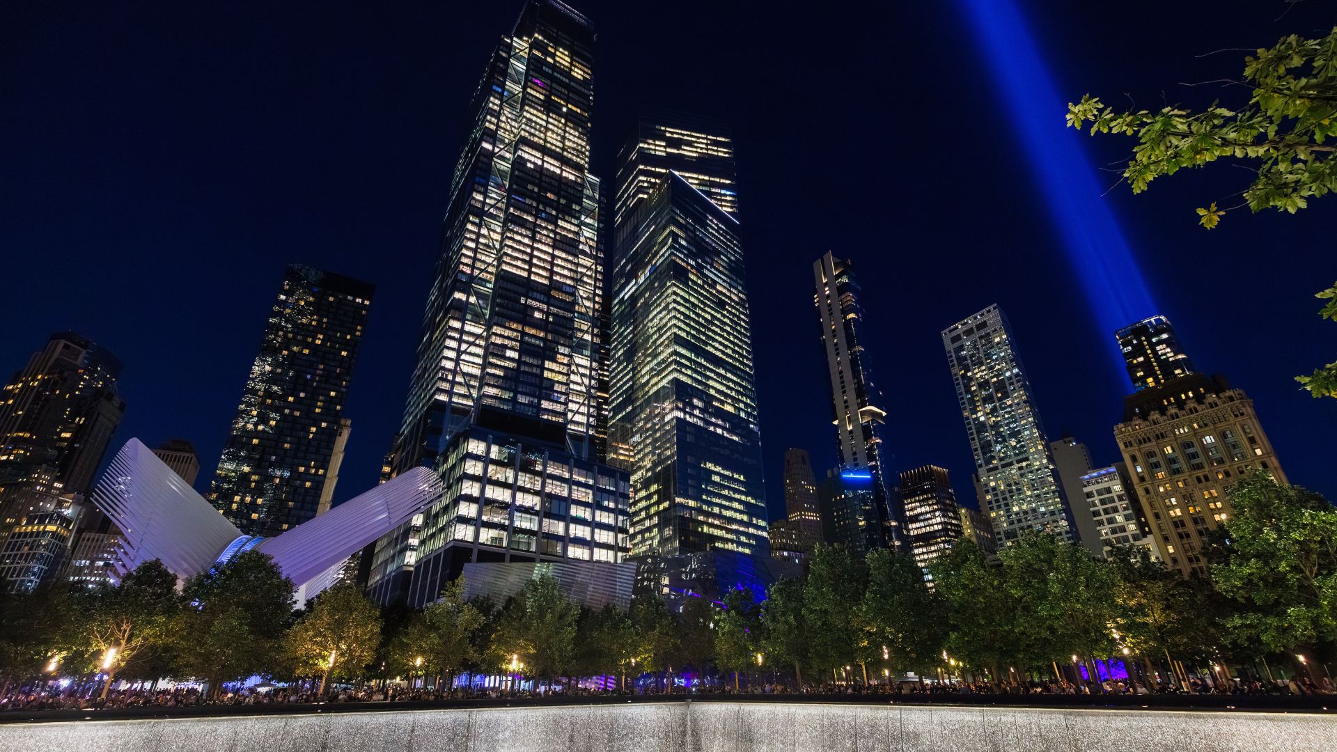 The Memorial Plaza at night, with the twin beams of Tribute in Light visible against the darkened sky