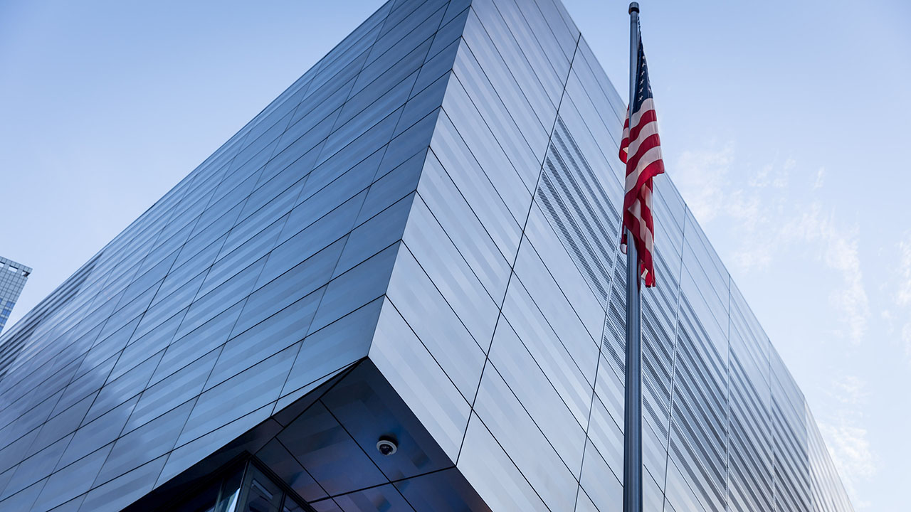 Exterior of the 9/11 Museum with the American flag in foreground