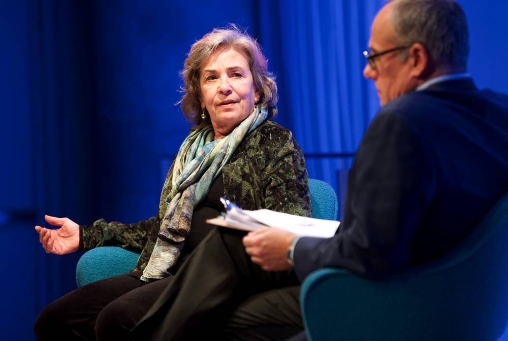 Dr. Sheila Carapico, professor of political science and international studies at the University of Richmond, speaks to Clifford Chanin, the executive vice president and deputy director for museum programs, as the two of them sit onstage in the Museum Auditorium.
