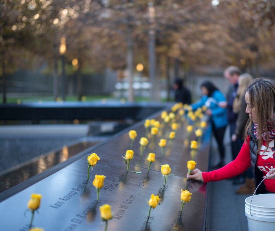 Yellow roses are placed on the Memorial 