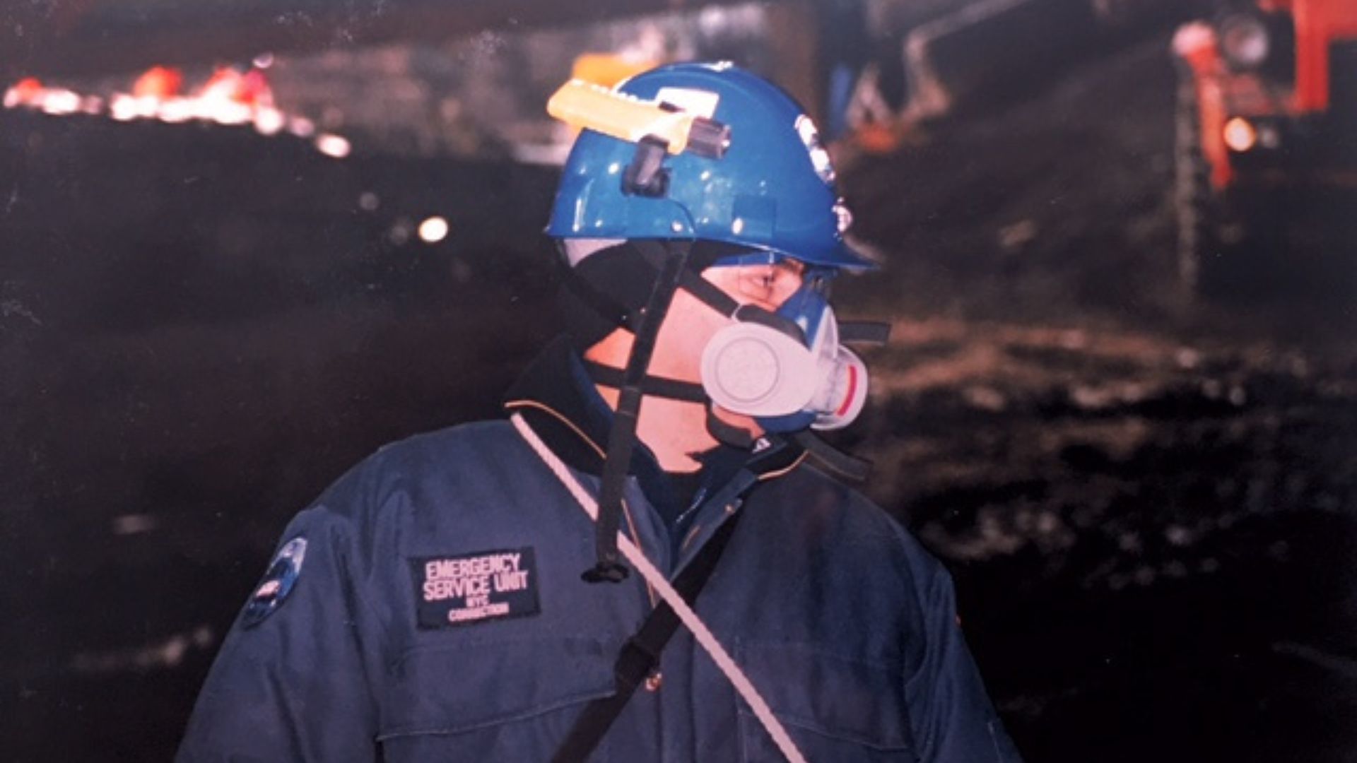 Department of Correction worker with hard hat and protective face mask at Ground Zero