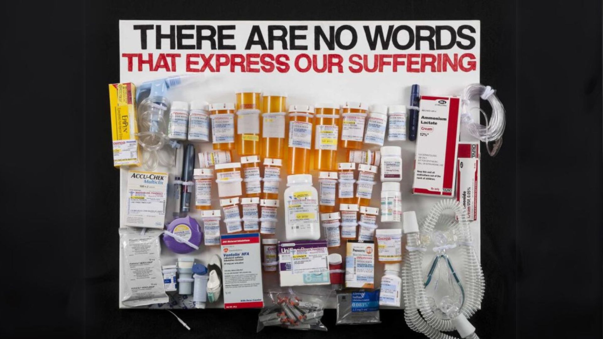 A mixed media poster made up of pill bottles and the text "THERE ARE NO WORDS THAT EXPRESS OUR SUFFERING"