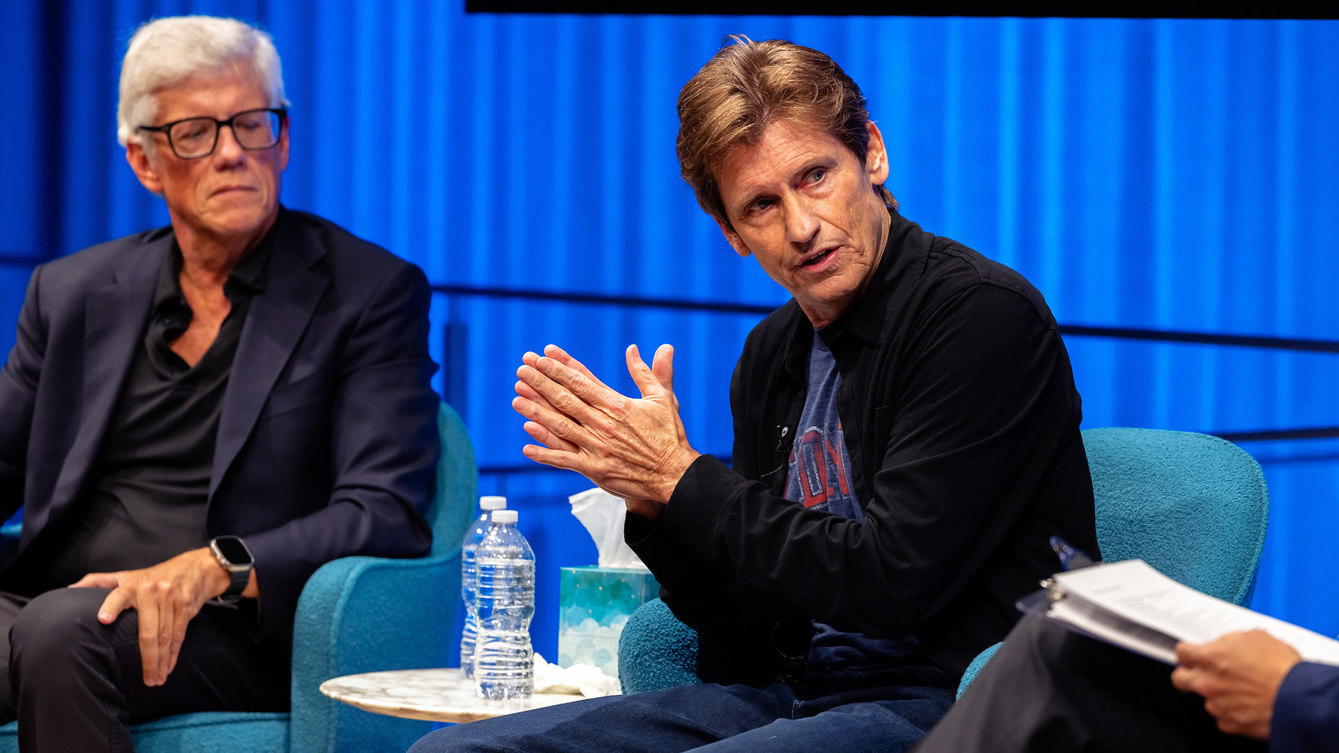 Peter Tolan (left) on sitting on stage with Dennis Leary (right).