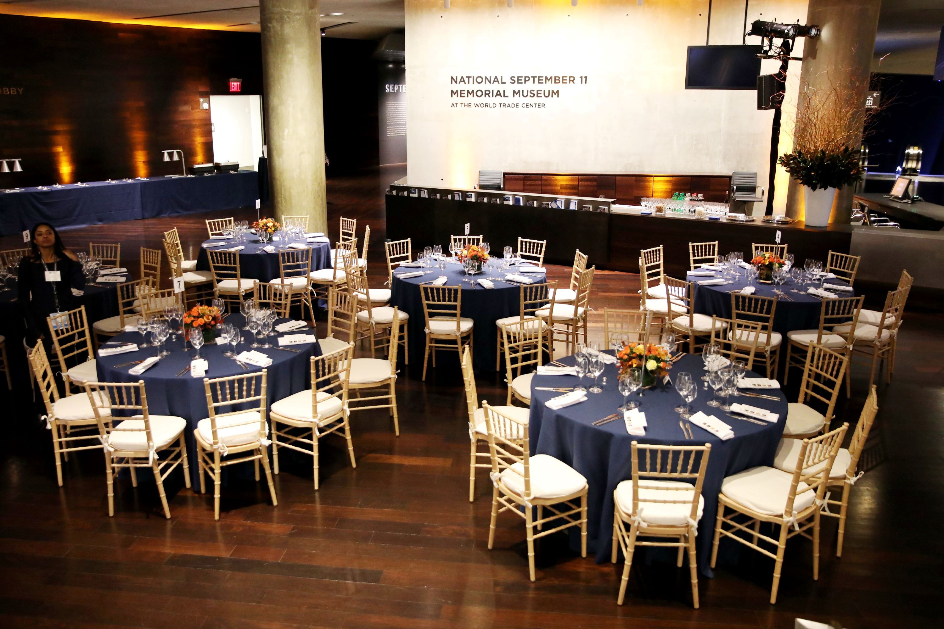 View from above with round tables set facing a stage