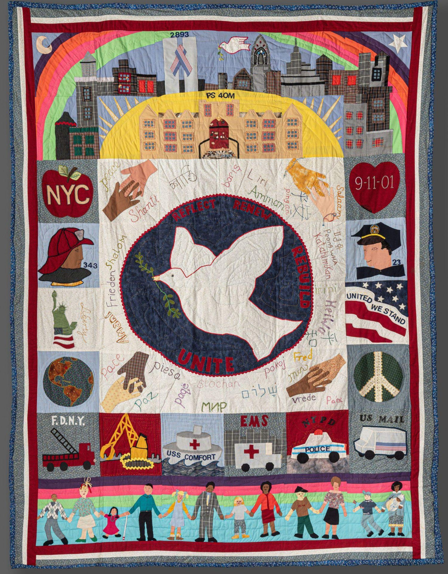 a large quilt with a dove in the center surrounded by red, white and blue panels depicting healing and recovery