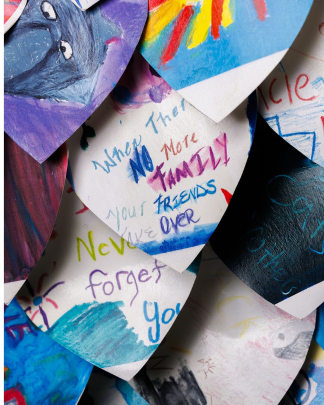 Paper "leaves" of the Phoenix displaying handwritten notes and artwork