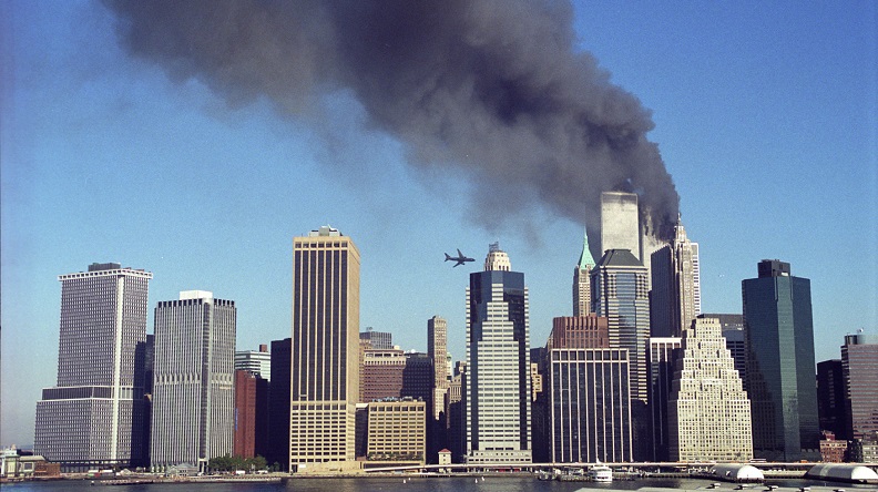 A historical image of the morning September 11th shows United Airlines Flight 175 moments before it was flown into the South Tower. 