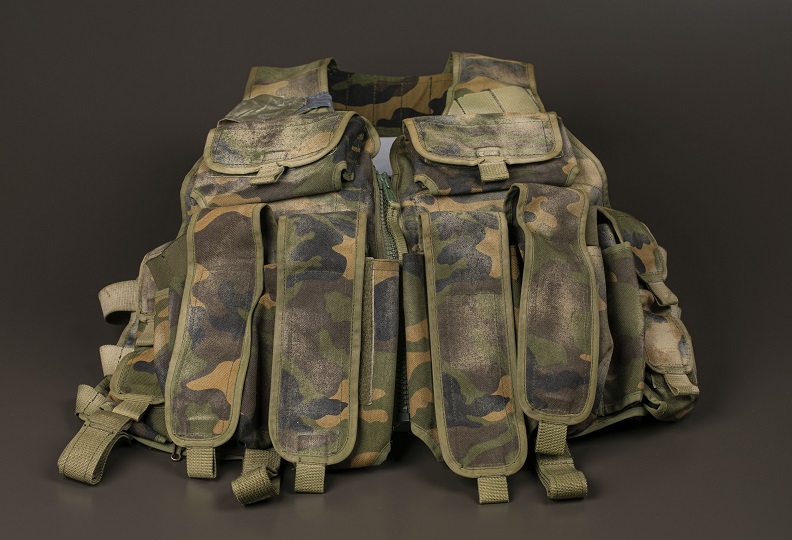 Camouflage utility vest with multiple pockets. 