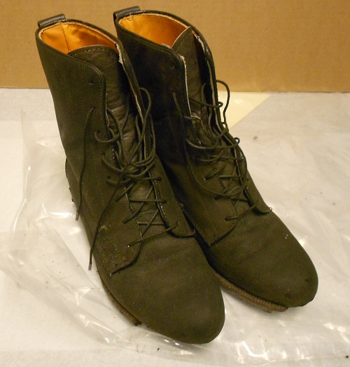 Black leather women's boots worn by Carol Orazem on Sept. 11, 2001. Gift of Carol Orazem. 