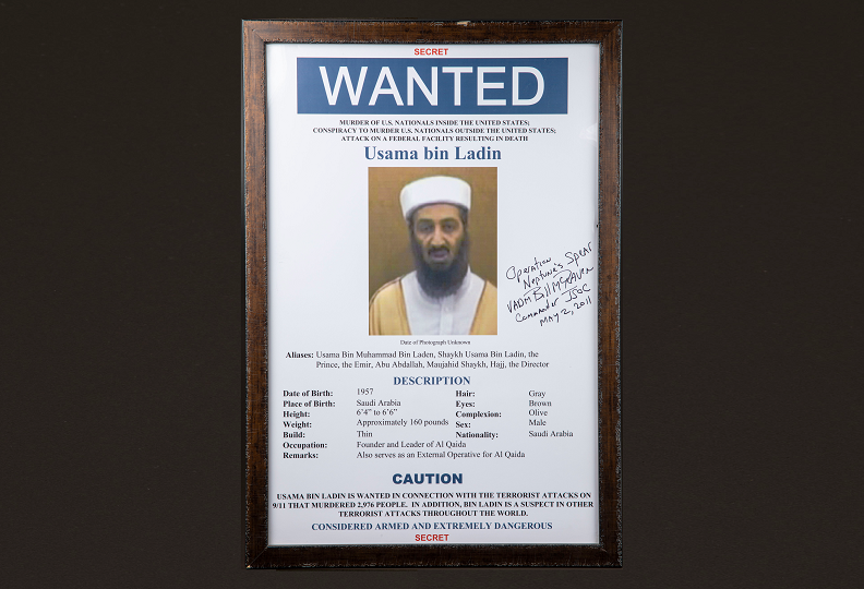Wanted poster for Osama bin Laden with a handwritten signature on it.