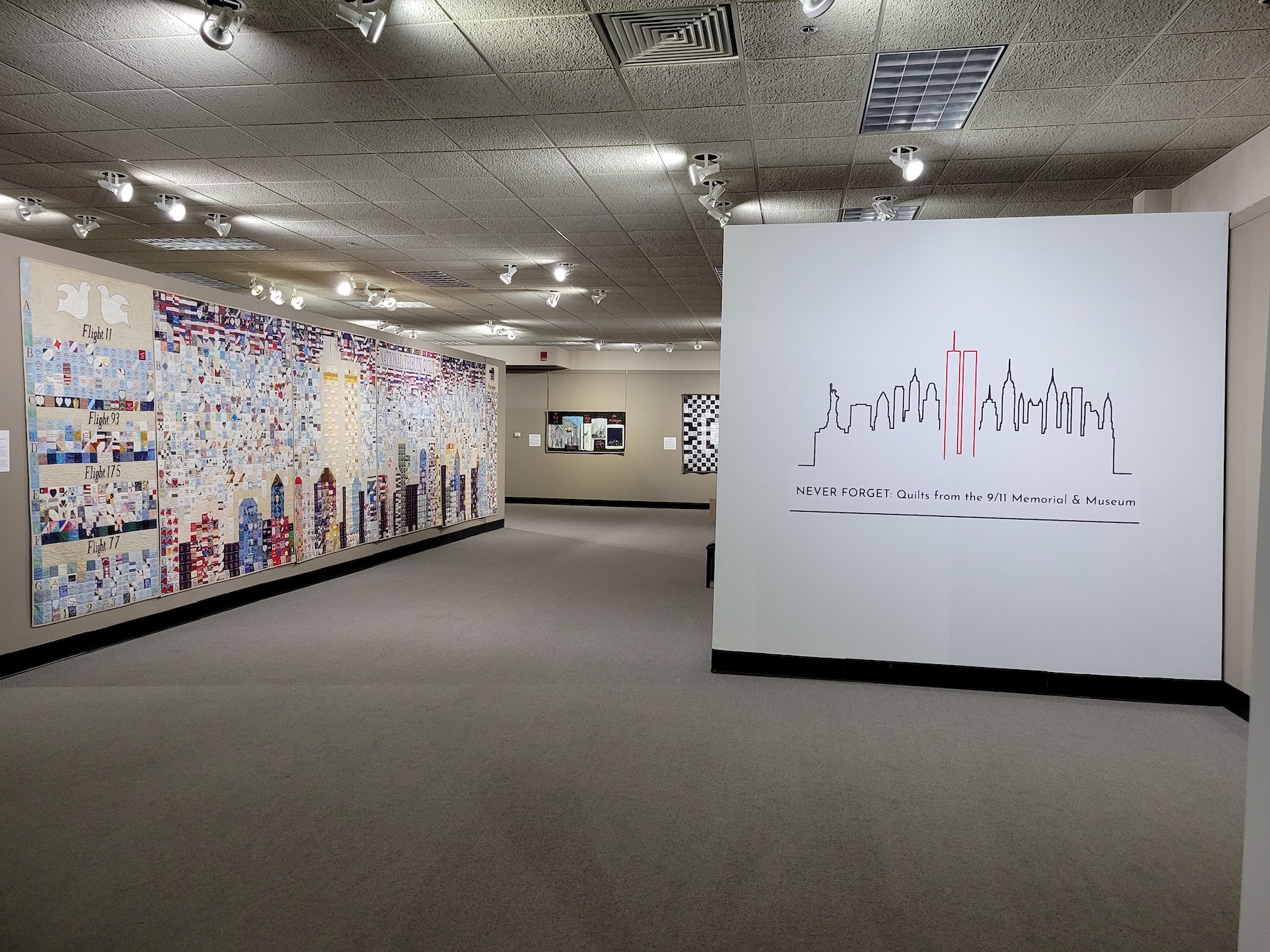 Interior of the National Quilt Museum exhibit featuring selected quilts from 9/11 Museum collection