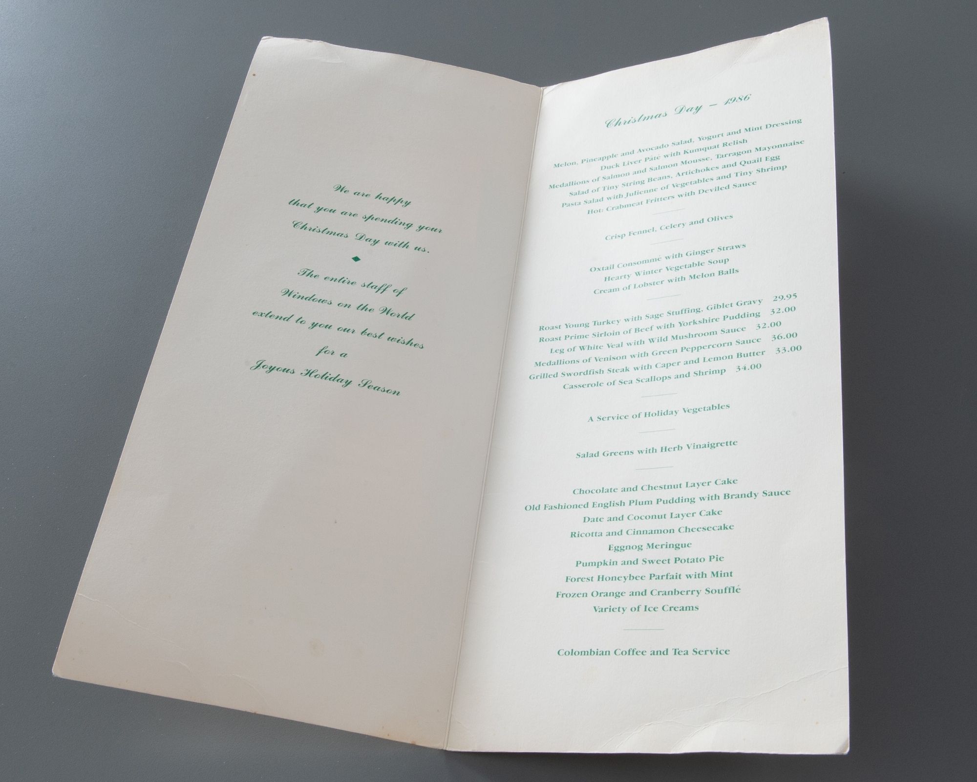 A cream-colored bi-fold holiday dinner menu with green print