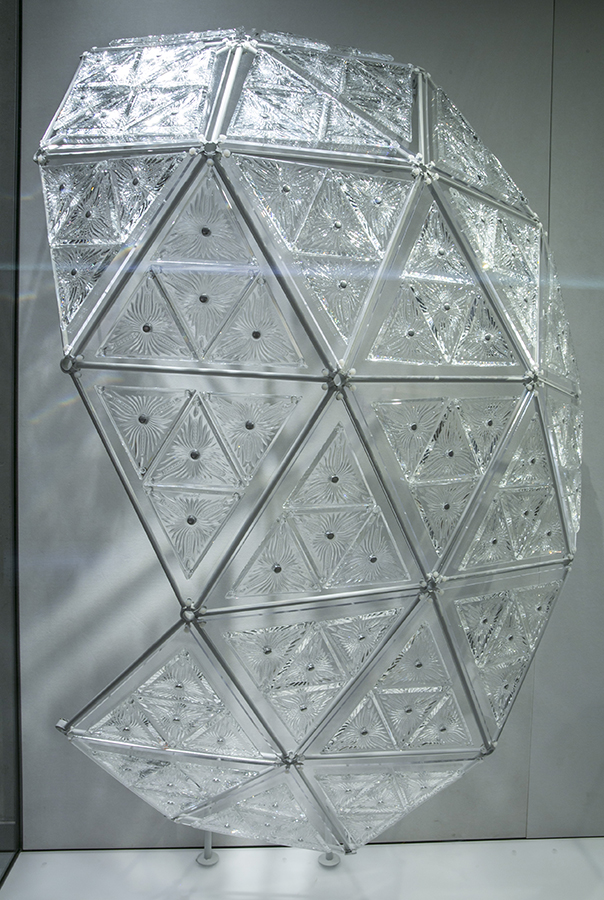 Rounded panel of engraved triangular crystals