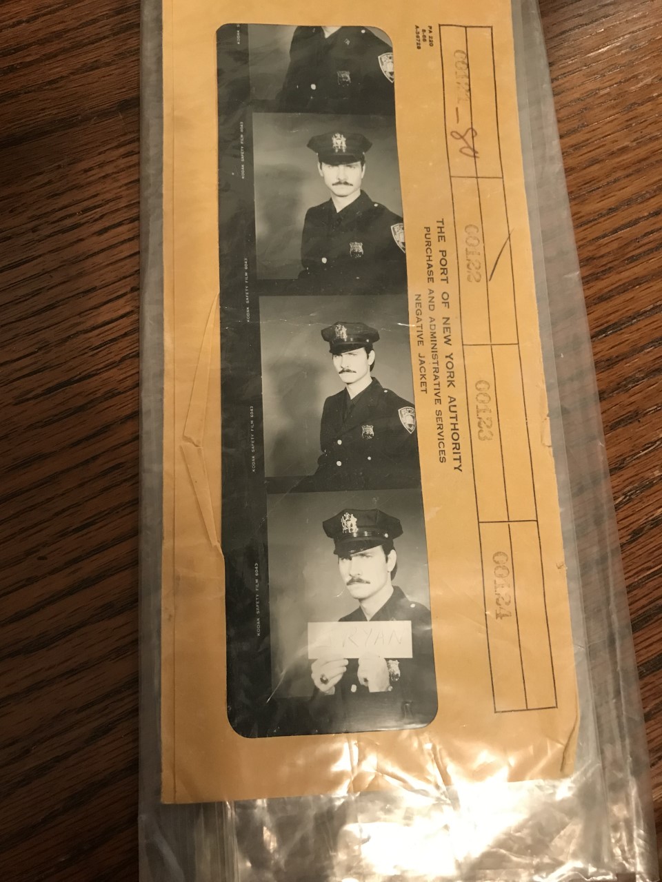 A strip of photographs showing a mustached man in a police uniform and hat