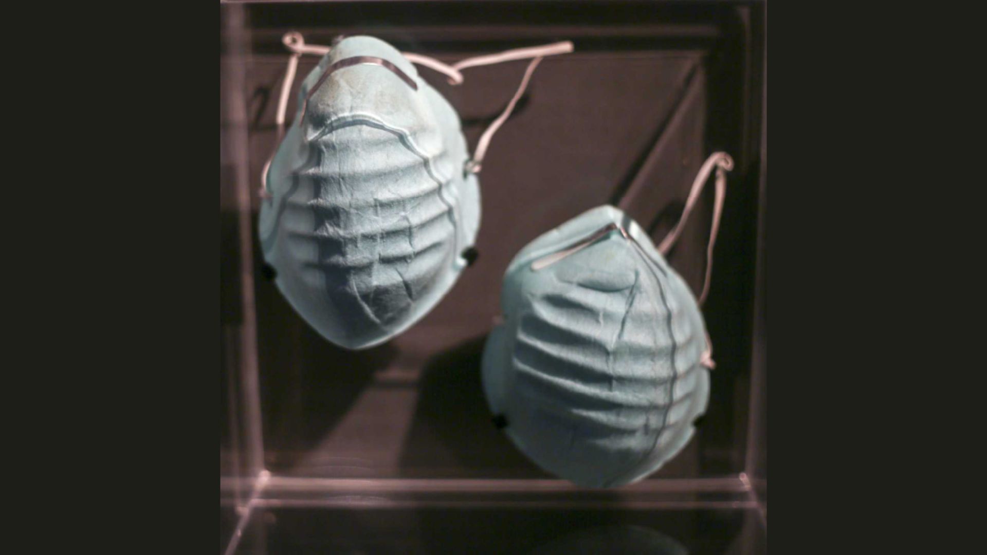 A pair of respiratory masks on display