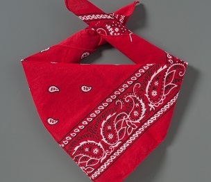 A red bandana that belonged to Welles Remy Crowther is displayed on a gray background.