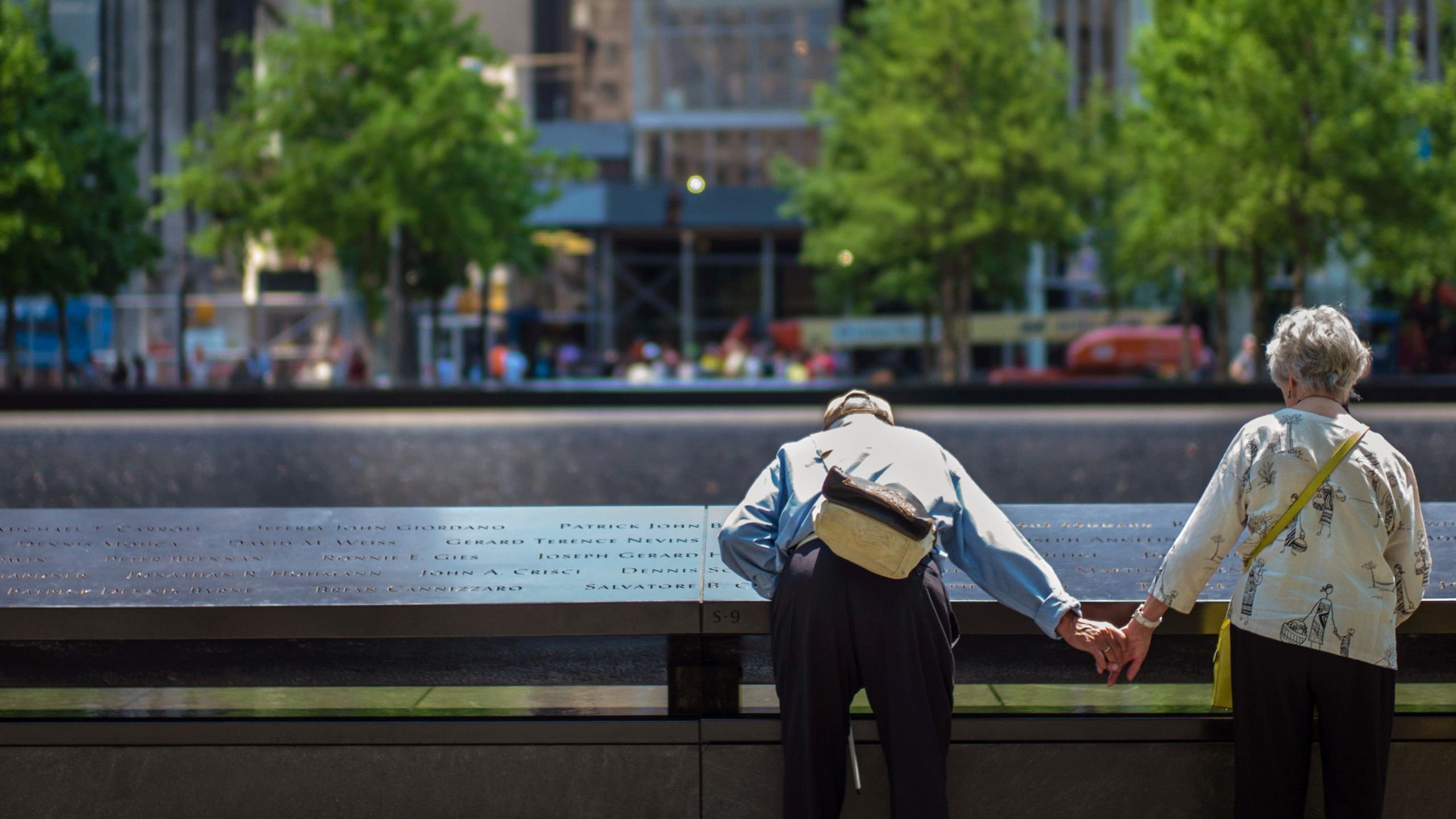 Man and woman at Memorial holding hands