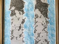 made to scale drawing of the twin towers. tiny stars cover the towers & surrounding area below, visually representing each life lost there. bright blue sky surrounds the image. 