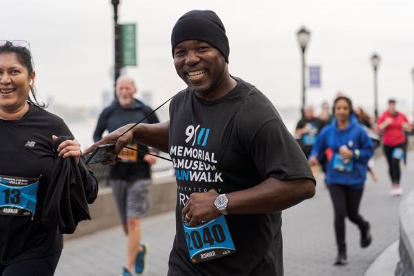 Man and woman running and smiling