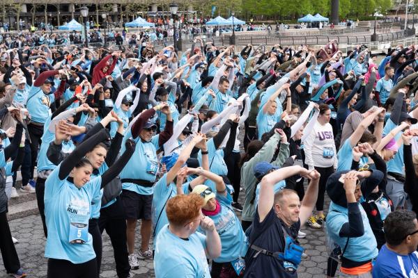 a group of people stretch before the race
