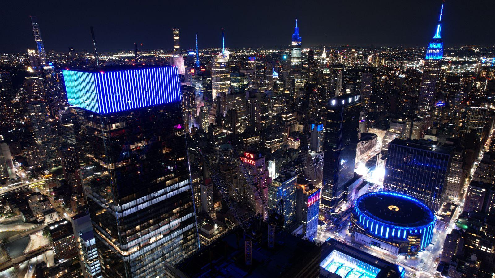 Skyline of Manhattan with buildings illuminated in blue