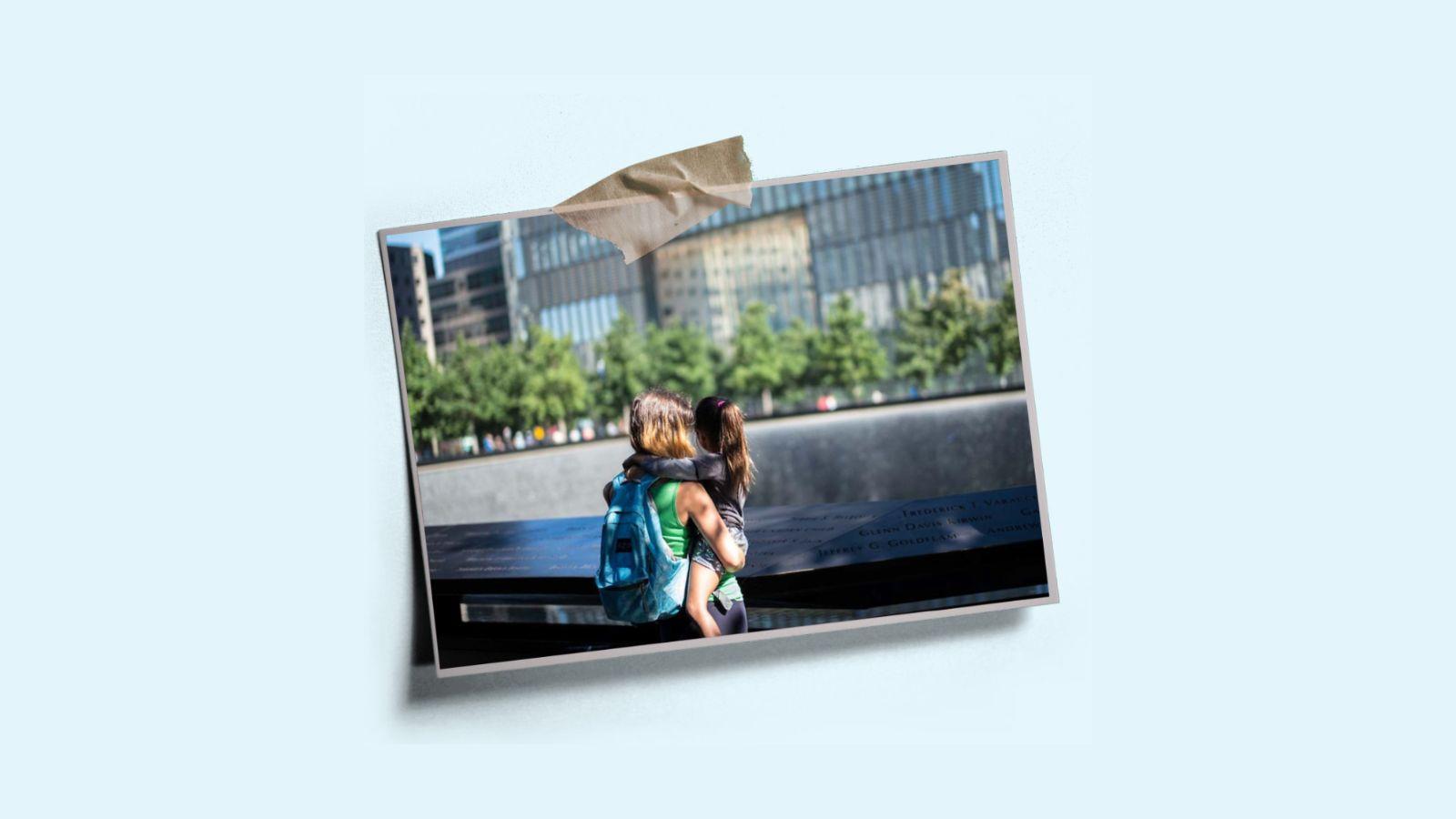 A photo of a woman and a child looking into one of the Memorial pools, taped to a light blue background