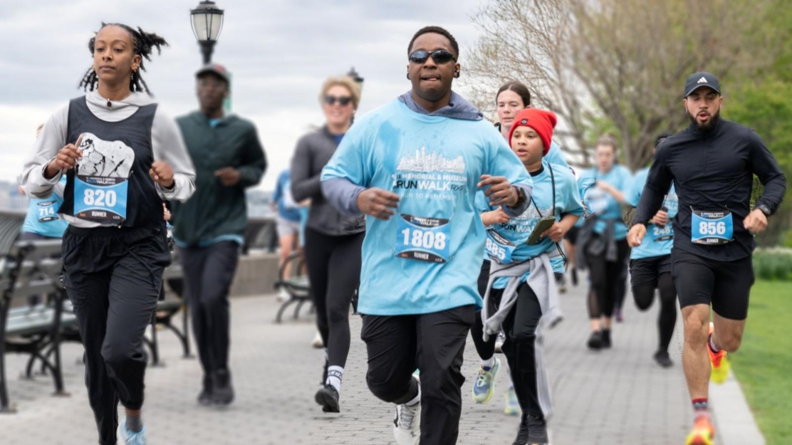 Runners mid-race along the Hudson River