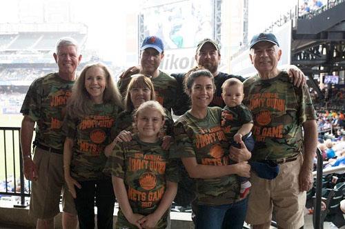 Joe Quinn and friends and family of Jimmy Quinn attend the 16th annual Jimmy Quinn Mets game. They are wearing camouflage shirts that read, “16th annual Jimmy Quinn Mets Game 2017.”