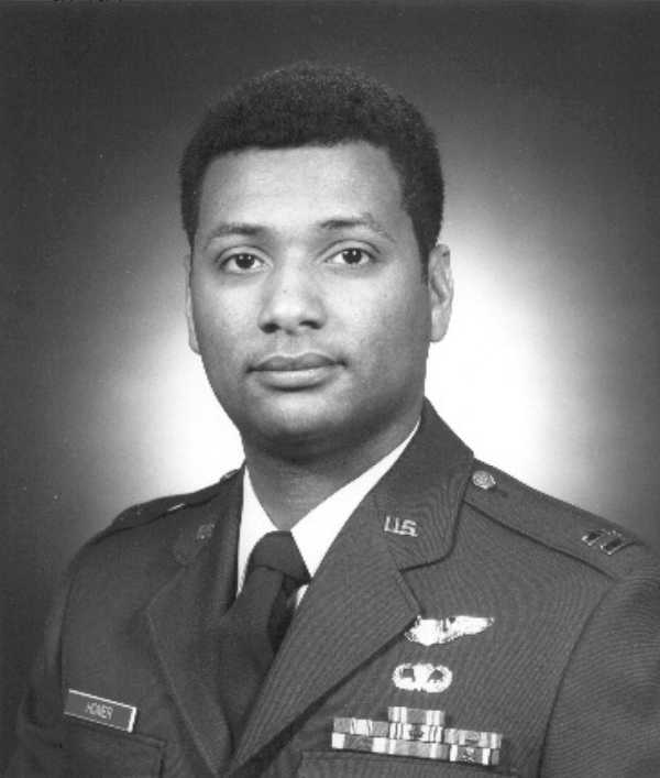 Leroy Homer smiles for an official, black and white U.S. Air Force portrait taken in 1992.